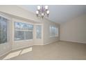 Bright living room featuring ample natural light, tile floors, and a cozy ambiance, creating a welcoming space at 21532 N 65Th Ave, Glendale, AZ 85308