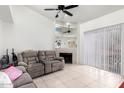 Cozy living room featuring a fireplace, plush seating, and bright natural light at 220 N 22Nd Pl # 2029, Mesa, AZ 85213