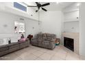 Inviting living room with a fireplace, comfortable seating, and a view to other rooms at 220 N 22Nd Pl # 2029, Mesa, AZ 85213