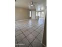Bright living room featuring tile flooring, large windows, and a neutral color palette at 2221 E Union Hills Dr # 157, Phoenix, AZ 85024