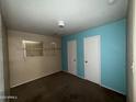 Bedroom featuring neutral paint, carpeted floors and two white doors at 2328 W Lupine Ave, Phoenix, AZ 85029