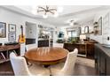 Open-concept dining and living area with stylish lighting, wet bar, and comfortable furnishings at 3031 N Civic Center Plz # 340, Scottsdale, AZ 85251