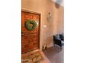 Inviting entryway with a wood door, wreath, and charming decor creating a welcoming ambiance at 3031 N Civic Center Plz # 340, Scottsdale, AZ 85251