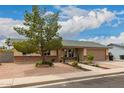 Single story home featuring desert landscaping, a two-car garage, and neutral exterior at 3144 S Rogers --, Mesa, AZ 85202