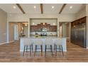 Beautiful kitchen island with granite countertops, wooden cabinets, and stainless steel refrigerator at 3171 S Hawthorn Ct, Gold Canyon, AZ 85118