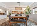 Cozy dining area features a large table with modern light fixture, tiled floors, and natural light at 349 E Thomas Rd # E401, Phoenix, AZ 85012