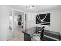 Well-lit office space with a modern desk, comfortable chair, and view of the fireplace at 3758 E Sunnyside Dr, Phoenix, AZ 85028
