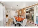 Bright dining room with wood table and slider to the back yard at 4008 W Citrus Way, Phoenix, AZ 85019