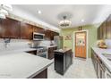 Modern kitchen featuring stainless steel appliances, granite countertops, and a center island at 4008 W Citrus Way, Phoenix, AZ 85019