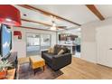 Comfortable living space with hardwood floors and an open concept to the kitchen at 4008 W Citrus Way, Phoenix, AZ 85019