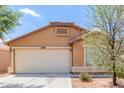 Charming single-story home with a two-car garage and well-maintained front yard at 41373 W Coltin Way, Maricopa, AZ 85138