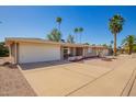 Attractive single-story home with a well-kept desert landscape and a convenient attached garage at 720 S Rosemont --, Mesa, AZ 85206
