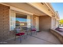 Cozy front porch area with seating, providing a relaxing outdoor space at 720 S Rosemont --, Mesa, AZ 85206