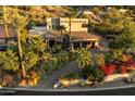 Gorgeous exterior elevation of stucco home with tile roof and well-manicured, desert landscaping at 7631 N 20Th St, Phoenix, AZ 85020