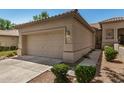 This home has a well-maintained lawn and a convenient two-car garage at 9649 E Holiday Way, Sun Lakes, AZ 85248