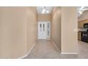 Inviting foyer features neutral walls, tile flooring, and a decorative glass front door at 9649 E Holiday Way, Sun Lakes, AZ 85248