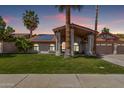 Charming single-story home with a well-manicured lawn and desert landscaping at 9736 E Ironwood Dr, Scottsdale, AZ 85258