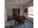 Cozy dining room featuring classic chandelier, wood furniture, and natural light at 11411 N 91St Ave # 75, Peoria, AZ 85345