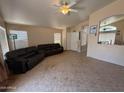 Inviting living room with tile floors, neutral walls, and ample seating at 1612 E Barbarita Ave, Gilbert, AZ 85234