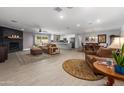 Bright and airy open floor plan with living, dining, and kitchen areas for comfortable living and entertaining at 1744 E Huber St, Mesa, AZ 85203