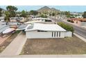 Well-kept single-story home featuring a spacious driveway and low-maintenance landscaping at 2346 E Sylvia St, Phoenix, AZ 85022