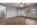 Spacious living area with wood-look floors and natural light from back patio at 3709 E Woodside Way, Gilbert, AZ 85297