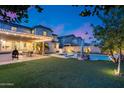Expansive backyard featuring a covered patio, built-in barbecue, and a sparkling pool/spa, ideal for outdoor entertaining and relaxation at 3933 E Alfalfa Dr, Gilbert, AZ 85298