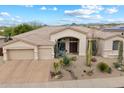 Beautiful single-story home with desert landscaping, three-car garage, and charming curb appeal at 11448 E Blue Sky Dr, Scottsdale, AZ 85262