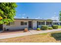 View of the home's exterior with a well-kept lawn and blue skies at 13261 N 110Th Ave, Sun City, AZ 85351