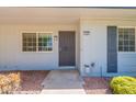 Front door view of well-kept home with desert landscaping at 13261 N 110Th Ave, Sun City, AZ 85351