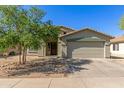Inviting single-story home with desert landscaping, two-car garage and an inviting, covered front entrance at 2122 W Alta Vista Rd, Phoenix, AZ 85041
