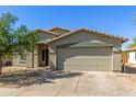 Charming single-story home featuring a two-car garage, desert landscaping, and a welcoming front entrance at 2122 W Alta Vista Rd, Phoenix, AZ 85041