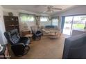 Cozy living room featuring plush seating, natural light, and a relaxing atmosphere for comfortable living at 2192 W Taos Ave, Apache Junction, AZ 85119