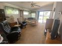 Comfortable living room with cozy seating, natural light, and sliding glass doors at 2192 W Taos Ave, Apache Junction, AZ 85119