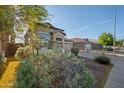 Charming two-story home with a well-maintained lawn and mature trees in a desirable neighborhood at 2206 S 114Th Ln, Avondale, AZ 85323