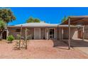 Charming single-story home with a covered carport and low maintenance desert landscaping at 2750 W Turney Ave, Phoenix, AZ 85017