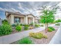 Well-kept front yard with lush landscaping leading to a charming single-story home with great curb appeal at 3879 E Harrison St, Gilbert, AZ 85295