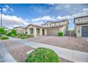 Lovely single-Gathering home with a two-car garage, xeriscaped front yard, and convenient sidewalk access at 3879 E Harrison St, Gilbert, AZ 85295