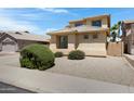 Charming two-story home featuring desert landscaping, neutral colors, and a well-maintained exterior at 43860 W Roth Rd, Maricopa, AZ 85138
