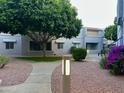 Property featuring a beautiful courtyard and walking path at 4444 E Paradise Village N Pkwy # 251, Phoenix, AZ 85032