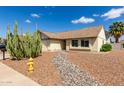 Landscaped home featuring desert-style yard with gravel, rocks and a yellow fire hydrant at 7302 W Meadowbrook Ave, Phoenix, AZ 85033