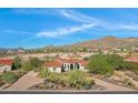 Expansive desert property featuring mature trees, a paver driveway, and mountain views at 8540 E Mcdowell Rd # 10, Mesa, AZ 85207