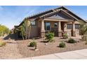 Attractive single-Gathering home showcasing a low-maintenance desert landscape and neutral color palette at 12269 E Chiricahua Pl, Gold Canyon, AZ 85118