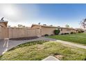 Exterior view of a home with lush landscaping and charming privacy features at 1310 S Pima -- # 6, Mesa, AZ 85210