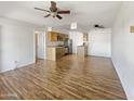 Bright living space featuring wood-style flooring, an open layout, and a ceiling fan for comfortable living at 1440 N Idaho Rd # 1048, Apache Junction, AZ 85119