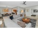 Spacious living room with stylish furniture and seamless flow to the dining and kitchen areas at 20121 N 76Th St # 1019, Scottsdale, AZ 85255