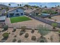 Expansive backyard featuring low-maintenance desert landscaping and a lush green lawn at 20638 N 11Th St, Phoenix, AZ 85024