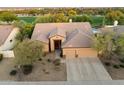 Beautiful aerial view of a home with tile roofing and a three car garage in a lush golf course community at 22231 N 55Th St, Phoenix, AZ 85054