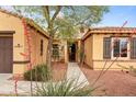 Charming single-Gathering home with a stone front door and landscaped front yard at 22815 N Arrellaga Dr, Sun City West, AZ 85375
