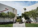 Exterior shot of the Brentwood Park Condominiums with mature landscaping and well-maintained lawns at 334 W Medlock Dr # D102, Phoenix, AZ 85013